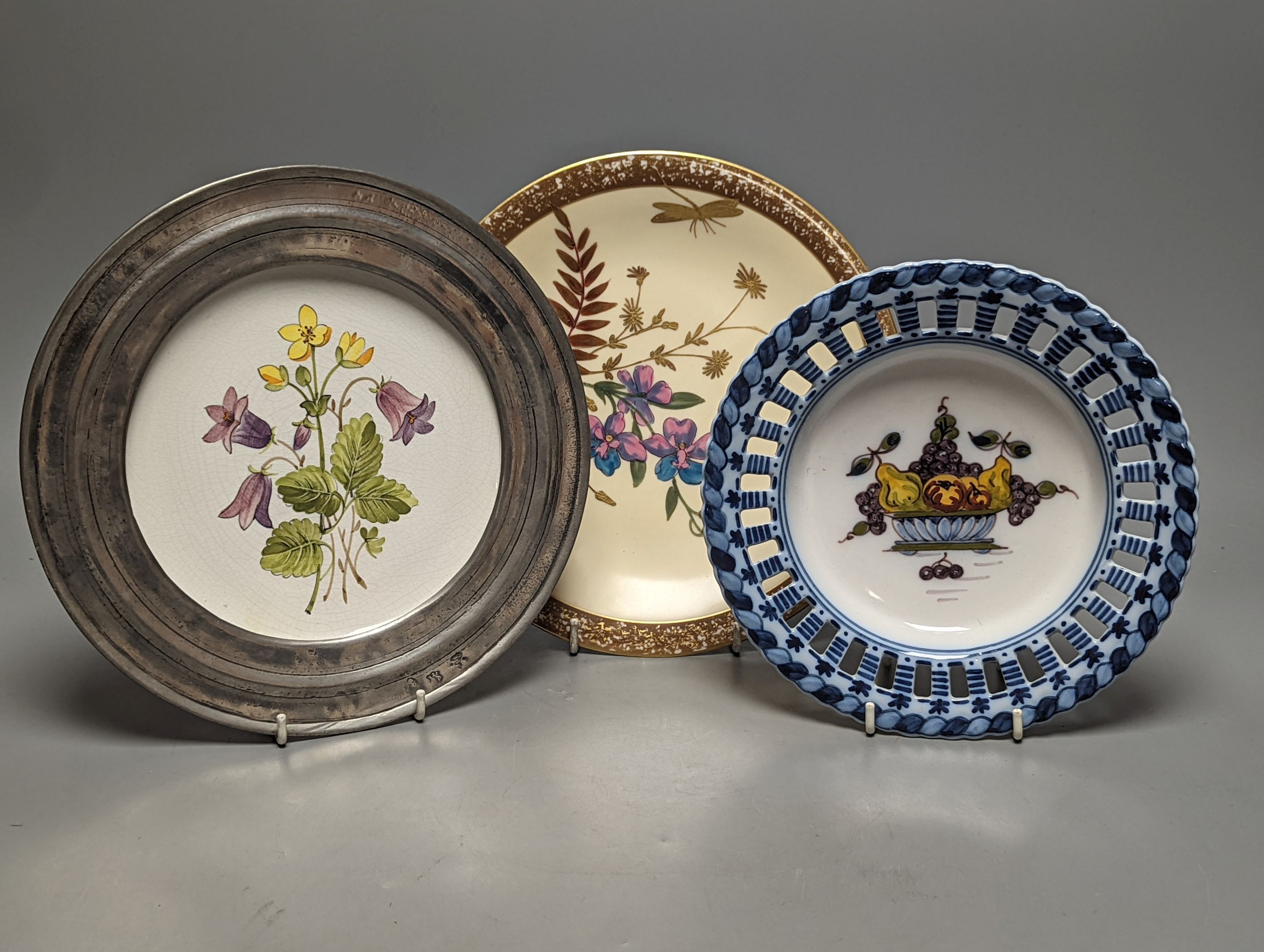 A collection of French pewter and ceramic plates, a set of Dutch fruit plates and a 2 part dessert service, large Rosenthal studioline Versace plates